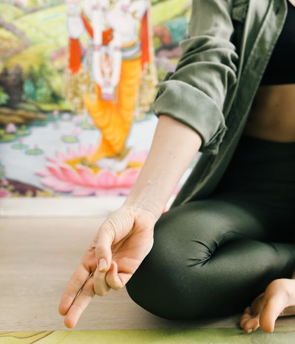 Woman in a calm yoga pose, embodying inner harmony and balance.